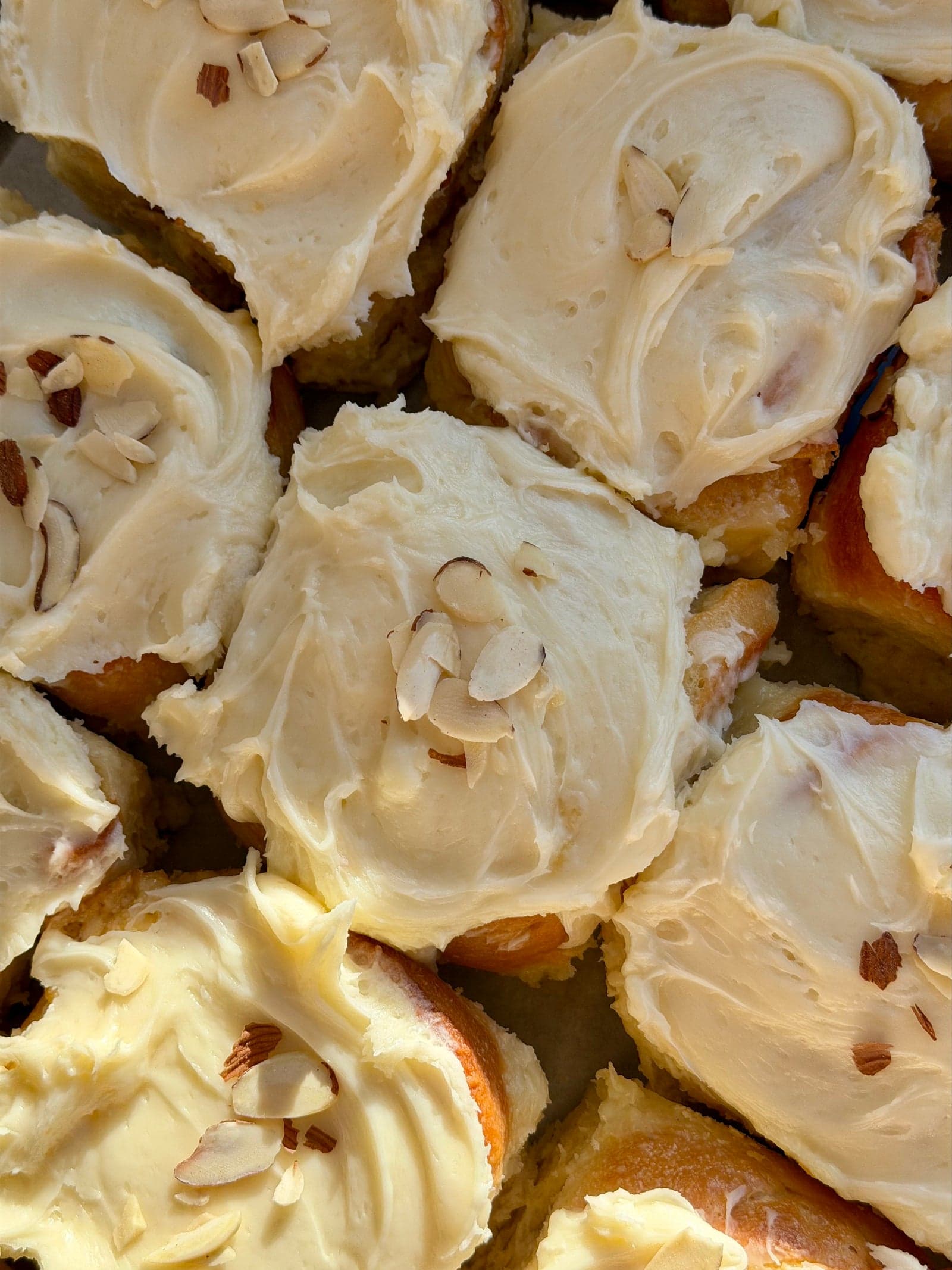 Frosted rolls topped with toasted almonds